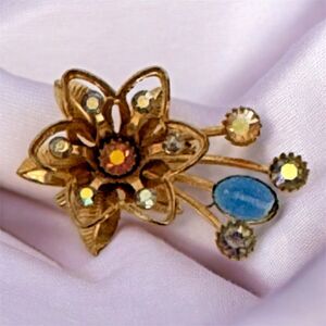 Vtg Goldtone Flower Brooch  Aurora Borealis Rhinestones  Blue Cabochon Accent